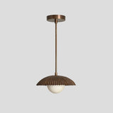 Industrial brass pendant lamp with ribbed dome shade and round opal glass globe, ideal for dining rooms, bedrooms, and cafes.