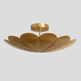Close-up of brass petal chandelier – handmade ceiling light with floral petal silhouette and brushed brass finish