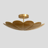 Side angled view of brass petal chandelier – modern floral ceiling fixture with handcrafted brass petals