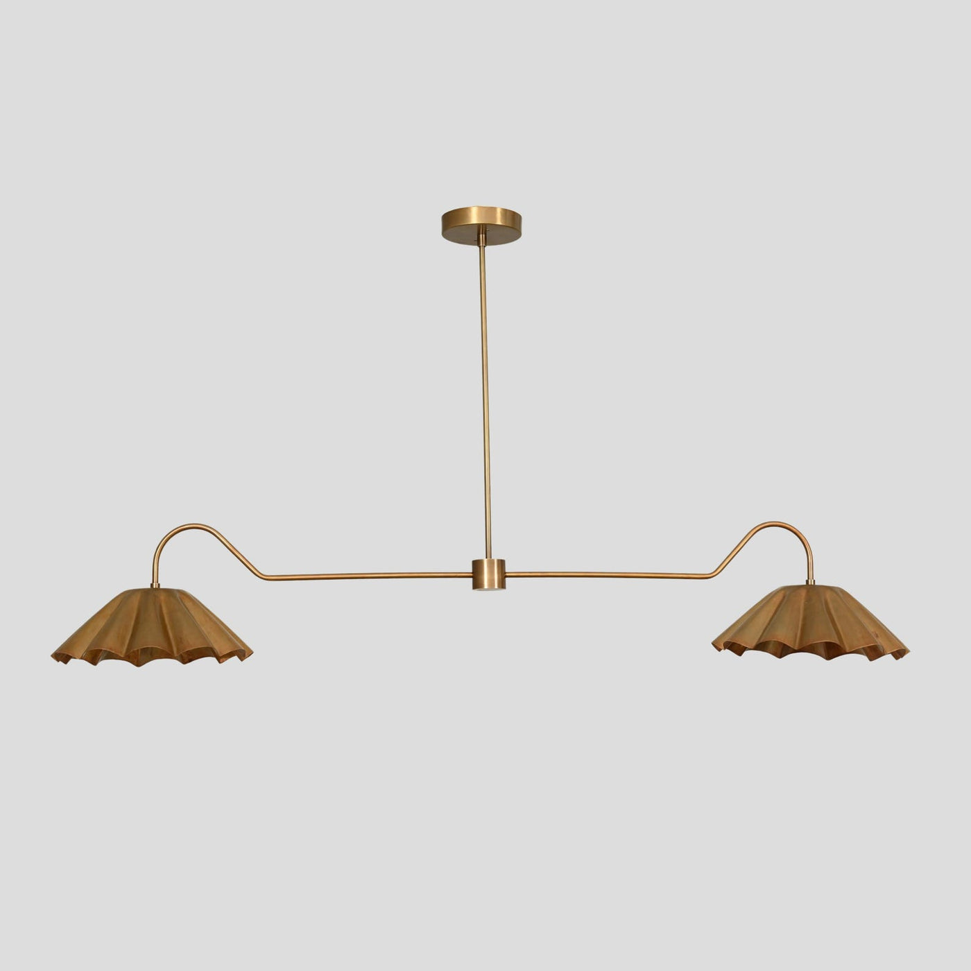 Handmade brass chandelier with two pleated bowl shades, modern customizable ceiling light by Brass Leaf Studio.