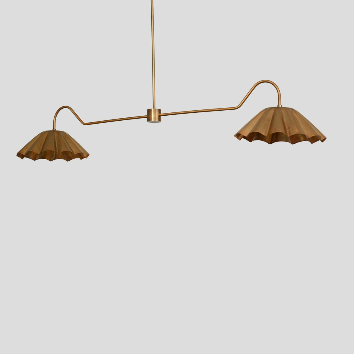 Linear brass chandelier with two pleated bowl-shaped shades, handmade modern ceiling lighting.