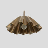 Front view of handmade brass wall sconce with ruffle shade, unique artistic wall lighting with bulb exposed