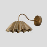 Handmade brass wall sconce with sculpted ruffle shade, artistic modern wall light fixture side view