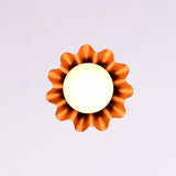 Side view of modern brass pendant chandelier with ruffled edge shade and frosted bulb