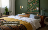Brass wall sconce mounted beside bed creating warm ambient bedroom lighting