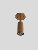Upward view of handmade brass ceiling spotlight with brushed finish and E26 bulb socket