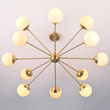 Bottom view of brass sputnik chandelier showing radial arms and evenly spaced opal glass globes