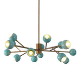 Modern brass sputnik chandelier featuring aqua enamel globes and elegant brass arms for bold, sculptural illumination.