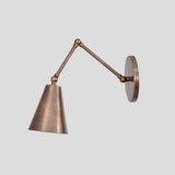 Adjustable brass swing arm wall sconce with conical shade, handmade by Brass Leaf Studio