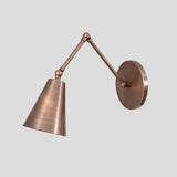 Handmade solid brass wall light with adjustable arm and brushed antique finish
