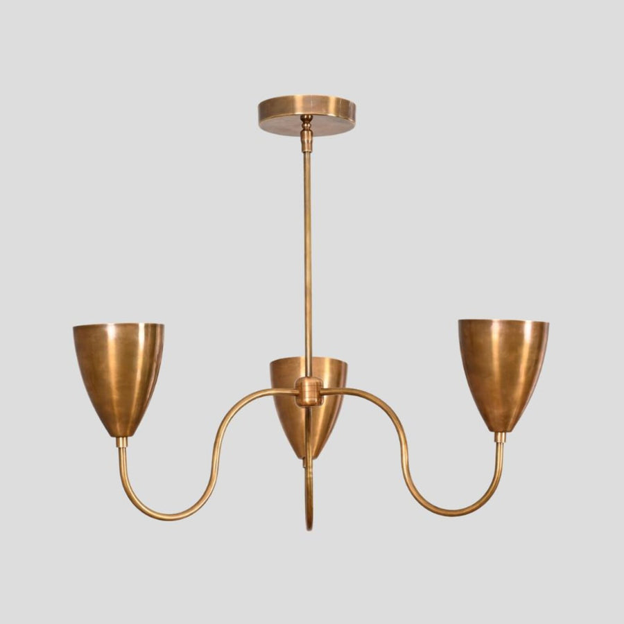 Handmade brass 3-light chandelier with curved arms and conical shades, modern industrial ceiling light by Brass Leaf Studio.