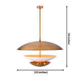 Brass tiered disc pendant light with wide upper shade, white diffuser bowl, and lower accent disc for luxury interiors