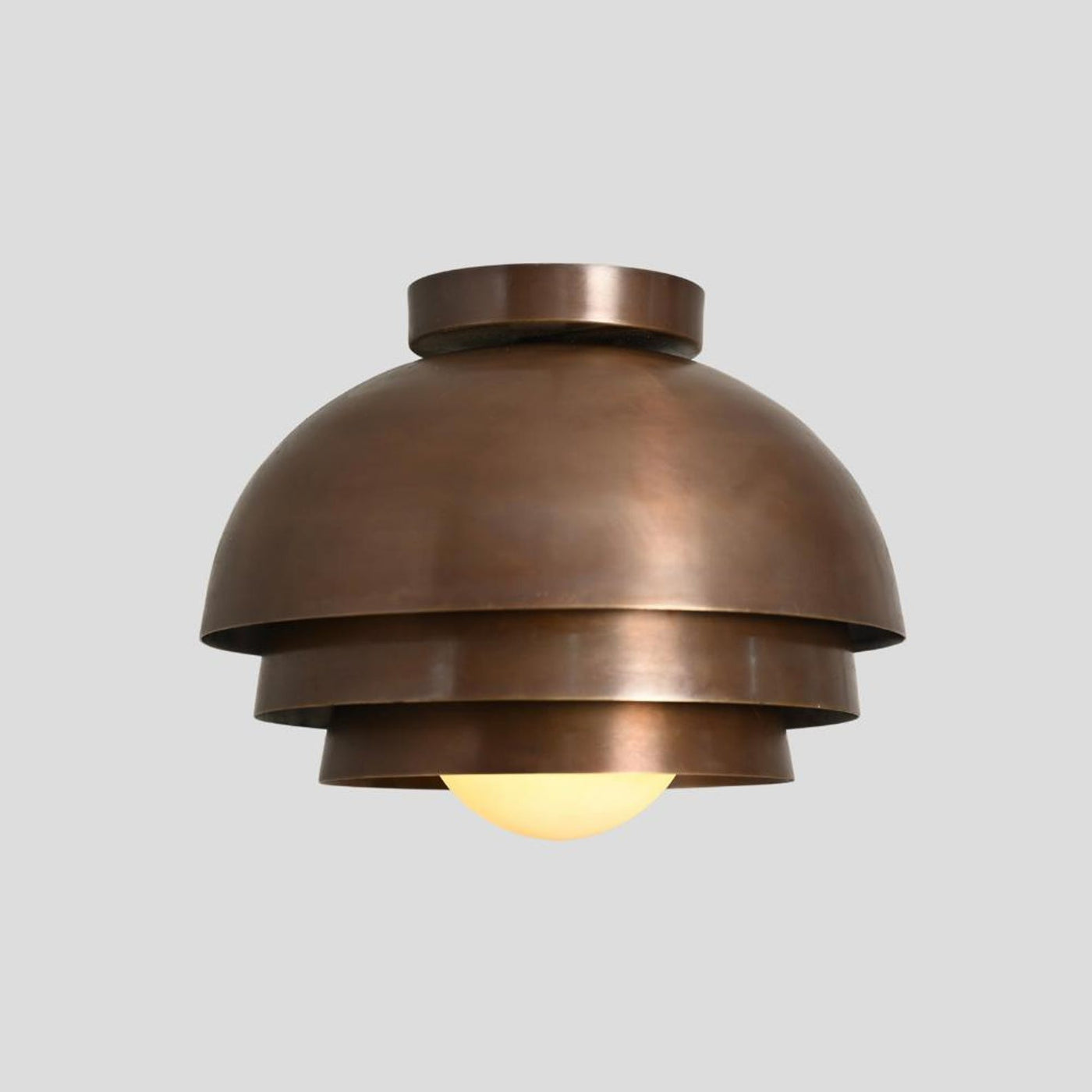 Front view of tiered brass dome flush mount chandelier – handmade 1-light ceiling light with warm ambient glow