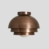 Side view of handmade brass tiered dome flush mount chandelier – minimalist modern ceiling light for living rooms, bedrooms, and entryways