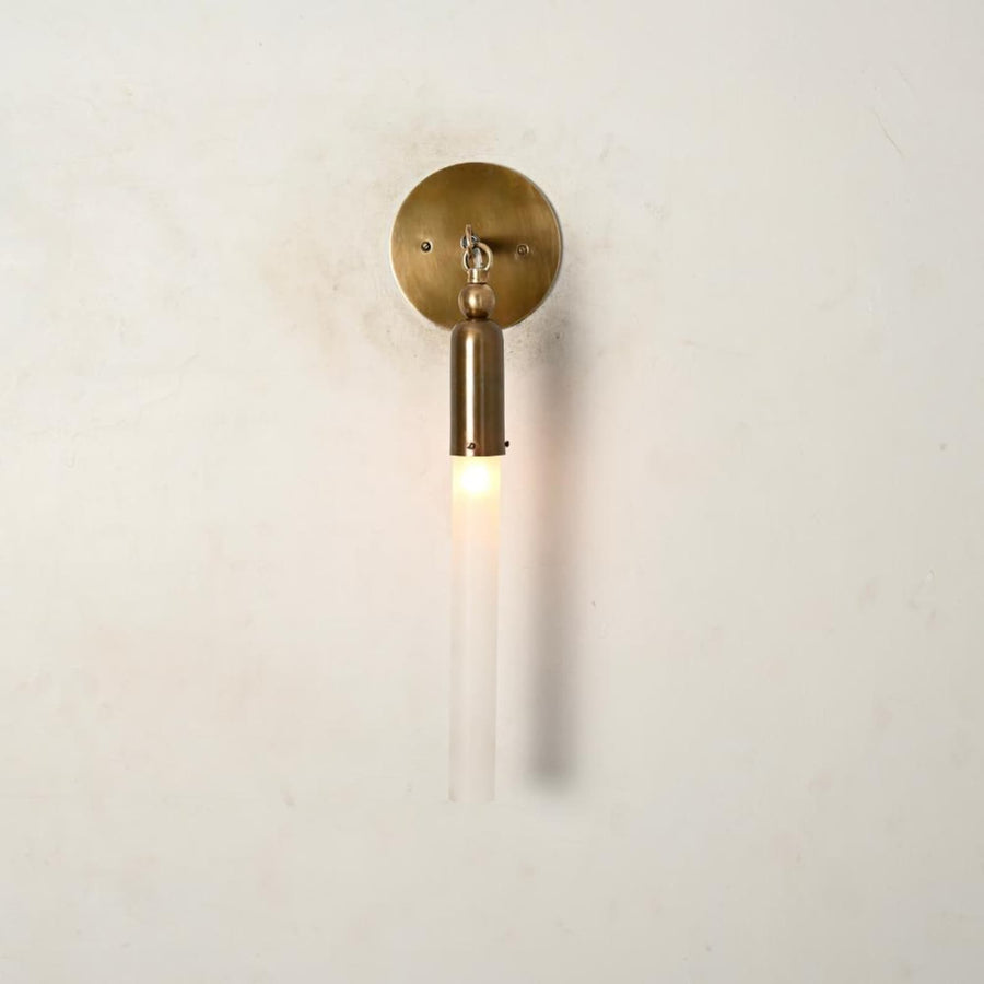 Handmade brass vertical wall sconce with slim glass tube shade, modern minimalist wall light front view