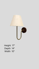 Brass wall light showing product dimensions—17-inch height, 14-inch depth, and 10-inch width with elegant brass frame and fabric shade.