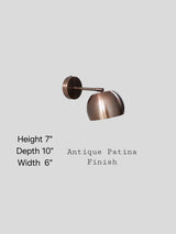 Antique patina brass wall light showing 7-inch height, 10-inch depth, and 6-inch width, handmade by Brass Leaf Studio