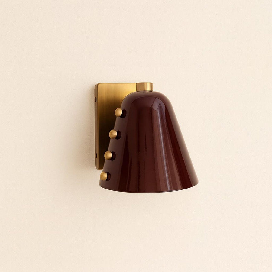 Modern brass cone wall sconce with burgundy metal shade and brushed brass backplate