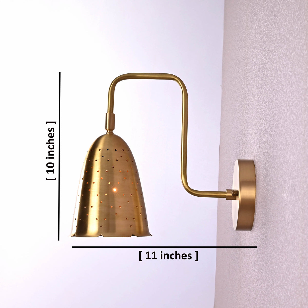 Brass wall sconce with perforated shade showing dimensions 11 inches width x 10 inches height