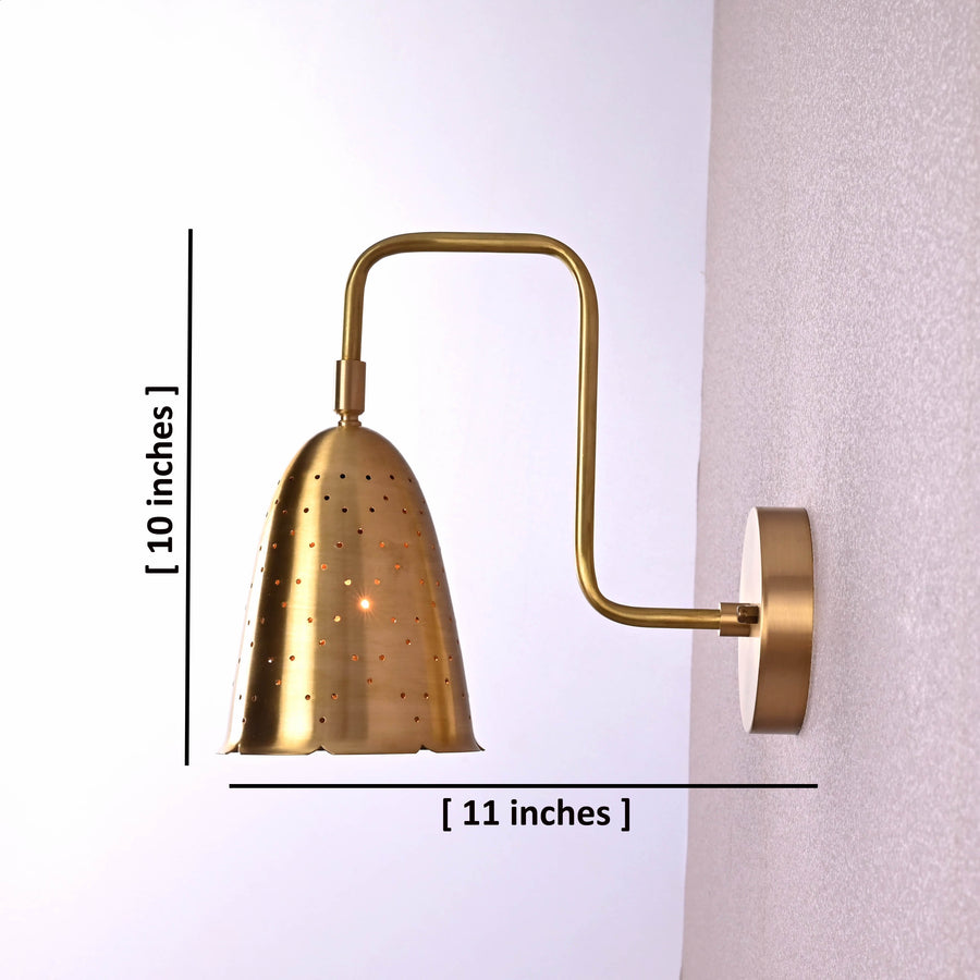 Handmade brass perforated wall sconce with curved arm and round backplate