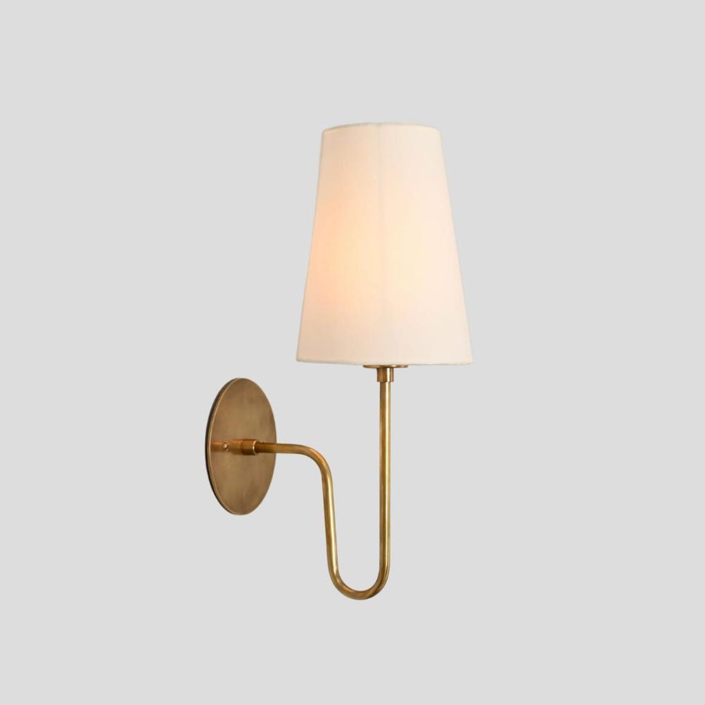 Handmade brass wall sconce with white fabric shade, minimalist design, front angle view – Brass Leaf Studio