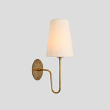 Handmade brass wall sconce with white fabric shade, minimalist design, front angle view – Brass Leaf Studio