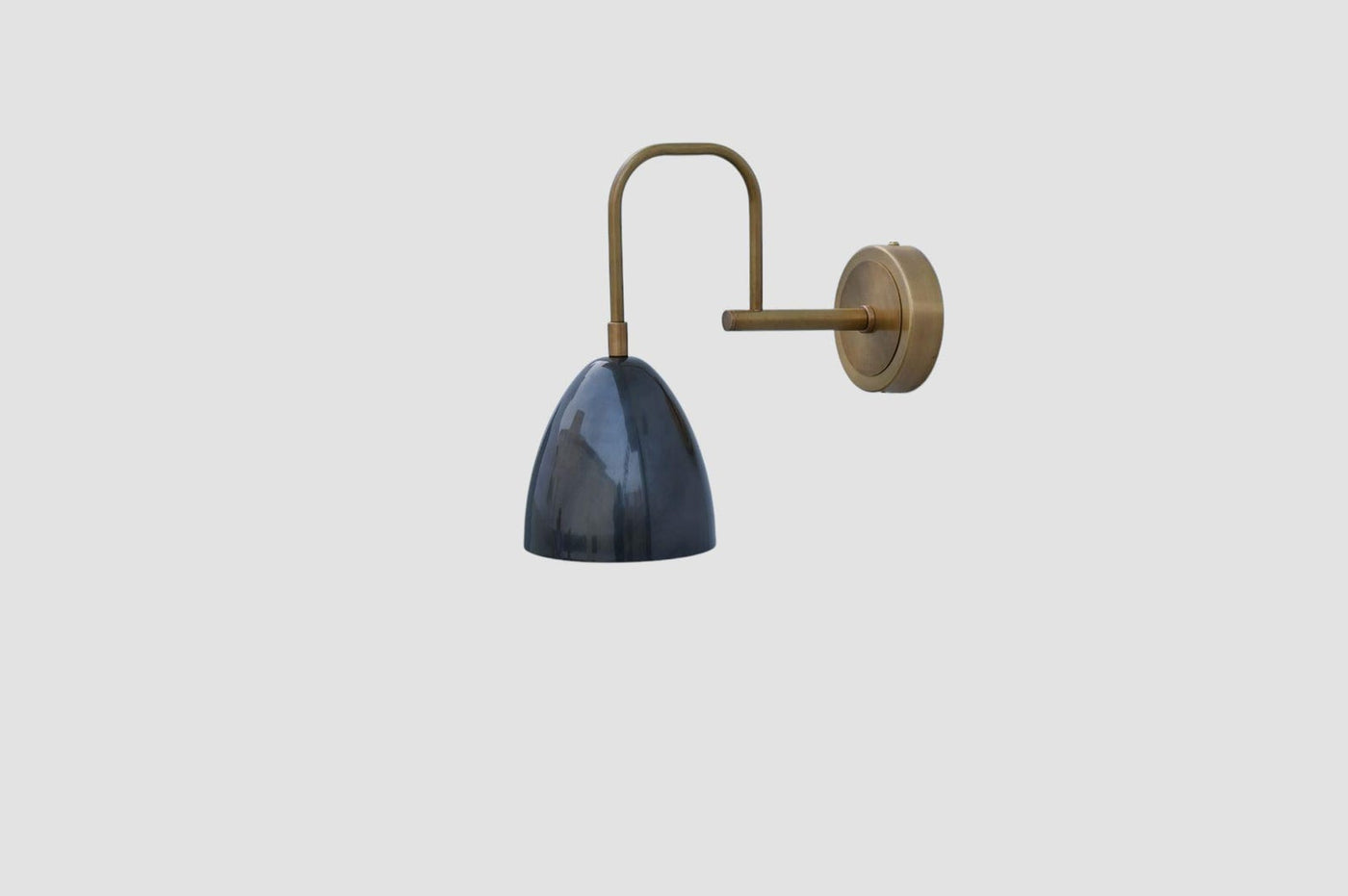Handmade brass wall sconce with blue dome shade, side view – minimalist industrial design by Brass Leaf Studio