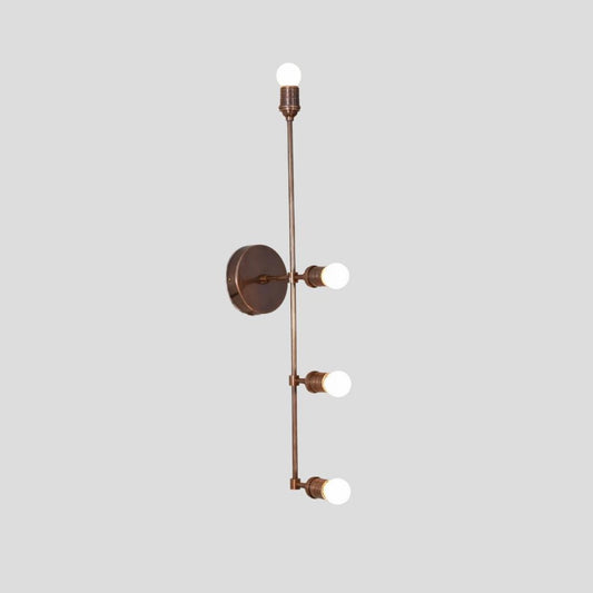 Vertical brass wall light with four exposed bulbs in a linear arrangement, perfect for hallways, bedrooms, and contemporary living spaces.