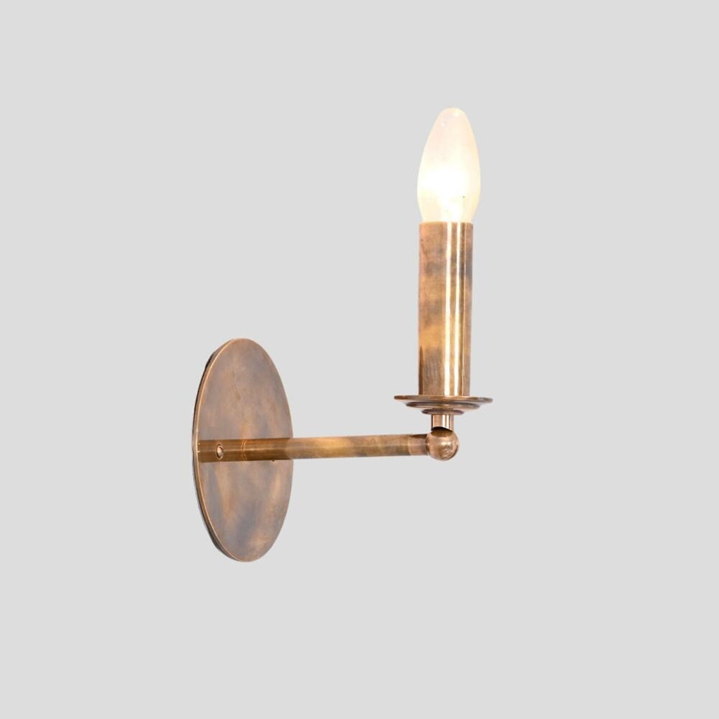 Handmade brass wall sconce in vintage candle style with warm glow – Brass Leaf Studio