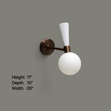 Brass and white globe wall sconce showing height 11 inches, depth 10 inches, and width 5 inches