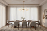 Brushed brass Sputnik chandelier with nine glowing glass globes creating warm ambient ceiling lighting