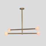 Brushed brass linear chandelier with four frosted globe shades, contemporary handmade ceiling light.