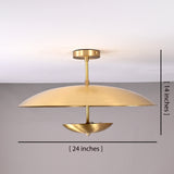 Modern brushed brass flushmount light measuring 24 inches wide and 14 inches high with sculpted dual-disc design