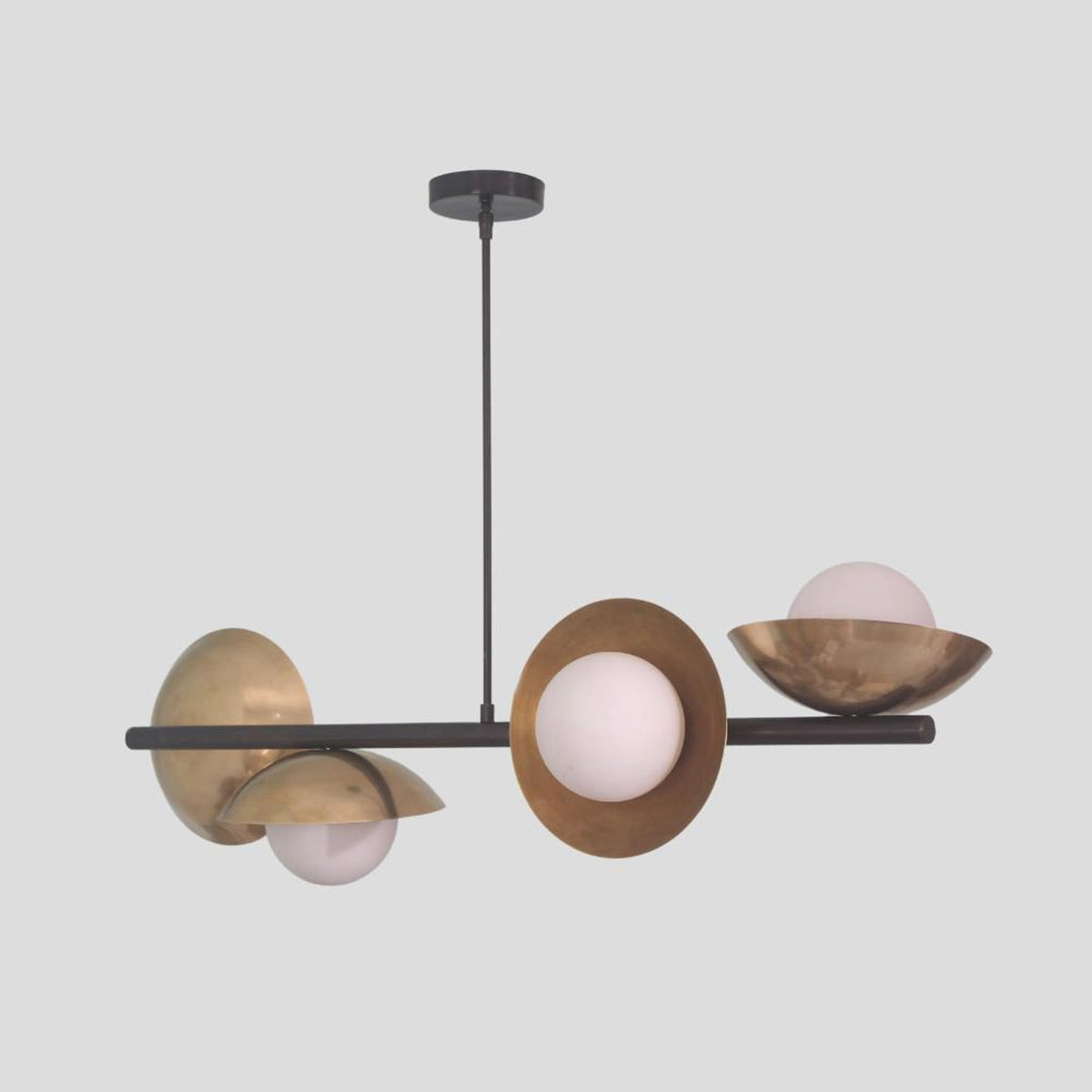 Brushed brass modern chandelier with three round globe bulbs and artistic bowl shades, ideal for living room or dining room lighting.