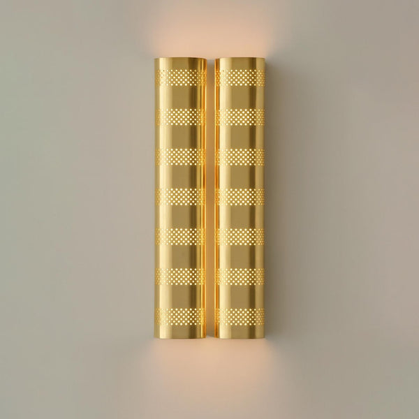 Brushed brass perforated wall sconce with warm ambient glow, modern industrial brass wall light by Brass Leaf Studio