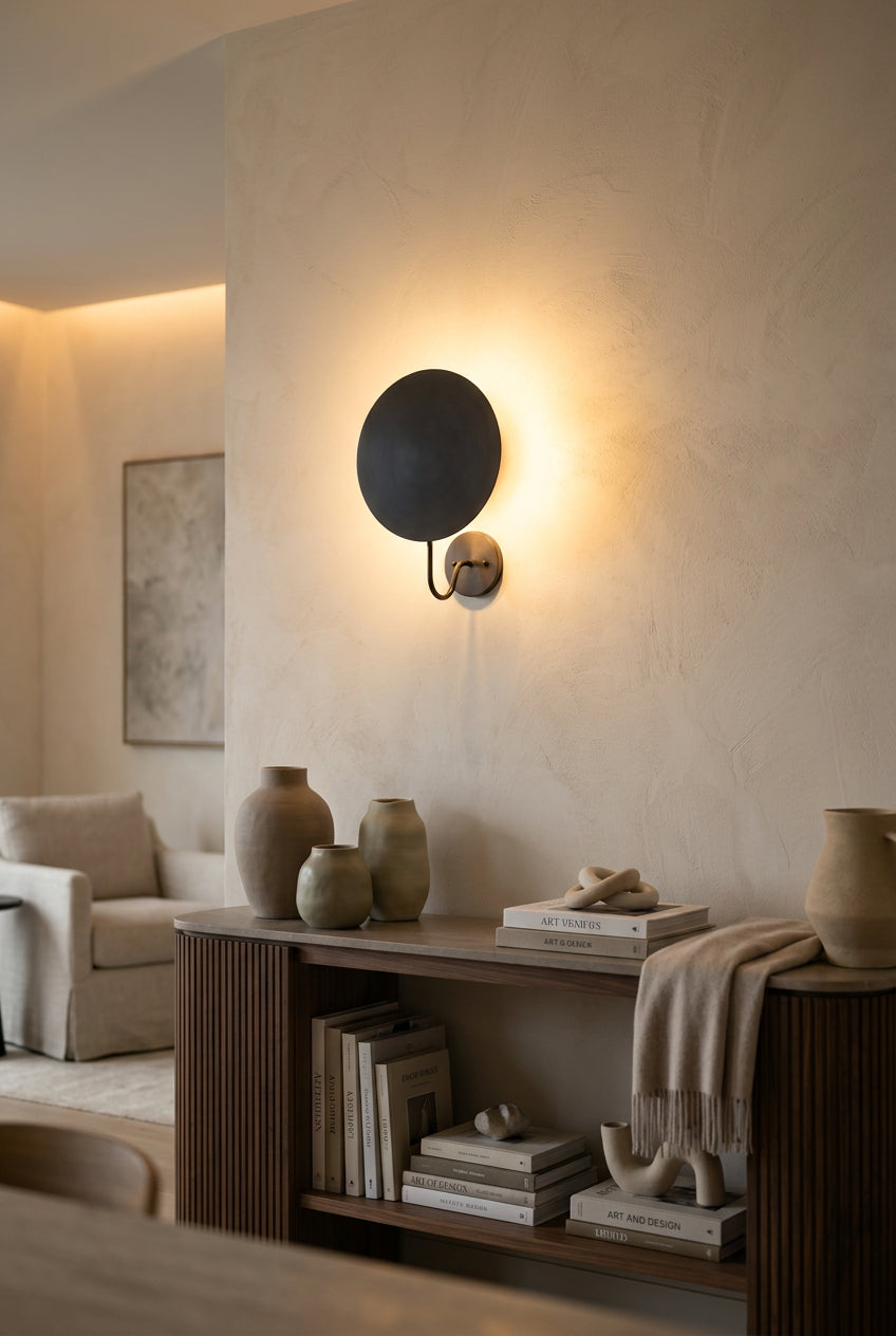Side view of Brussels wall sconce showing curved arm, round canopy and projecting disc shade