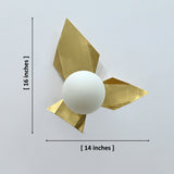 Brussels brass leaf glass globe wall sconce in raw brass finish with sculptural folded leaf design and warm ambient glow