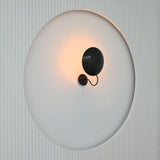 Sculptural Brussels wall light with large convex disc shade and minimalist blackened brass finish