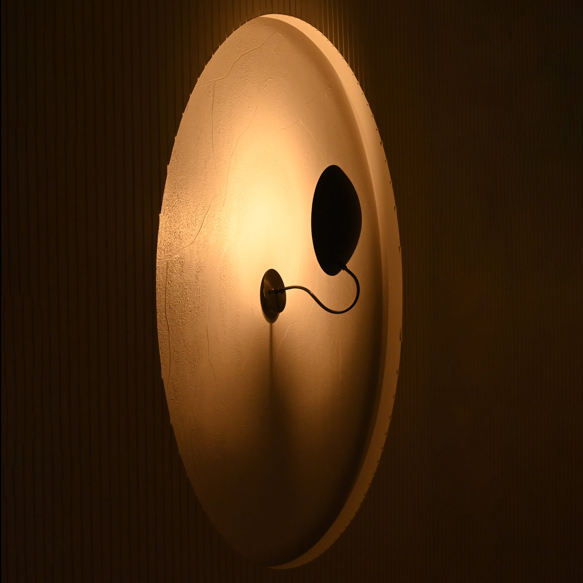 Brussels curved disc wall sconce approximately 11 inches high and 12 inches wide
