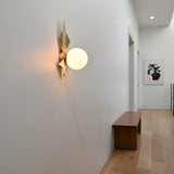 Brussels wall sconce dimension view showing 16 inch height and 14 inch width with glass globe and brass leaf design