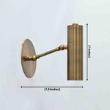 Casablanca solid brass cylindrical wall sconce in brass patina finish with round wall canopy and angled support arm