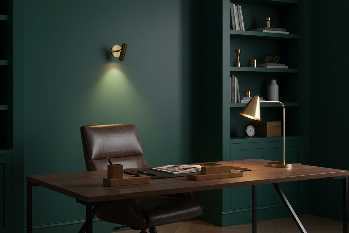 Casablanca brass wall sconce shown illuminated with soft warm light projected downward on the wall