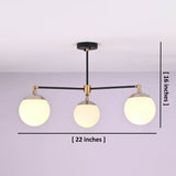 Brass and matte black 3-light chandelier with opal glass globes, shown with 22 x 16 inch dimensions