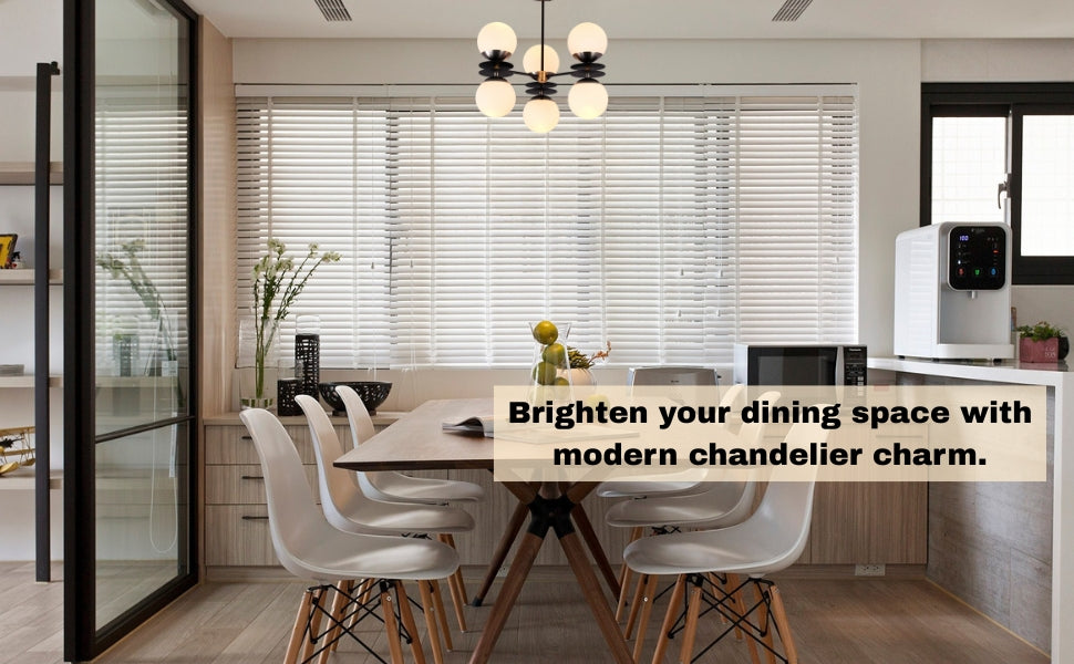 6-globe brass and black chandelier installed above a dining table in a modern kitchen interior