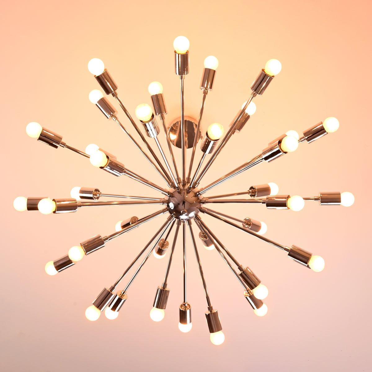 Bottom view of modern chrome Sputnik chandelier with multiple arms radiating light symmetrically