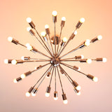 Bottom view of modern chrome Sputnik chandelier with multiple arms radiating light symmetrically