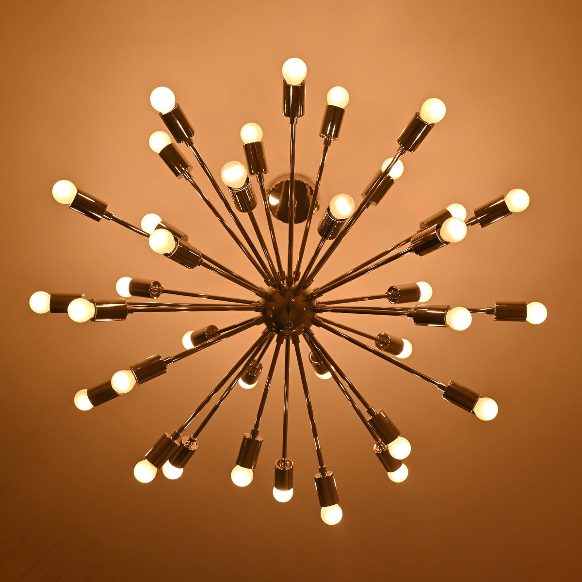 Top glowing perspective of handmade chrome Sputnik chandelier with uniform circular bulb arrangement