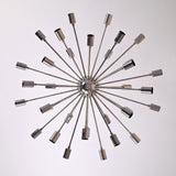 Top view of chrome Sputnik chandelier displaying 36 radiating brass arms in a modern geometric arrangement