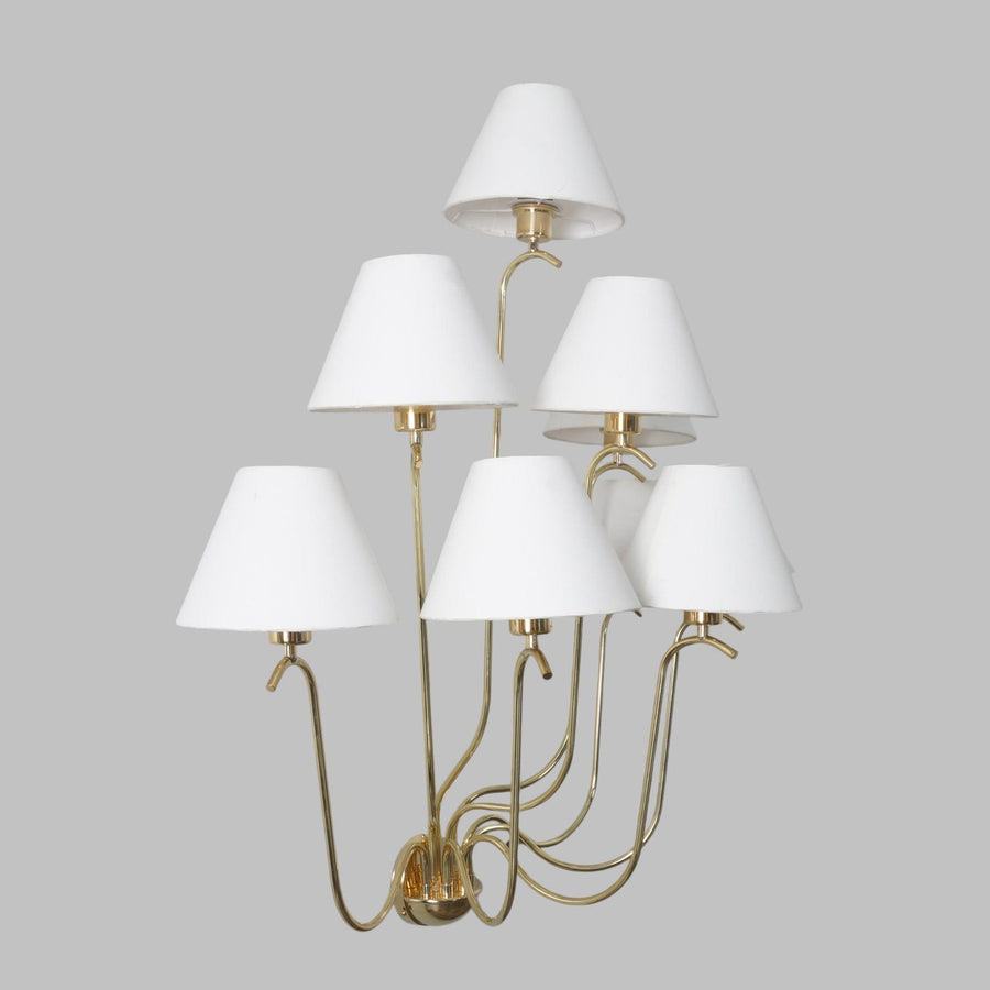 Elegant brass multi-arm chandelier with nine white fabric shades, handcrafted lighting fixture by Brass Leaf Studio.
