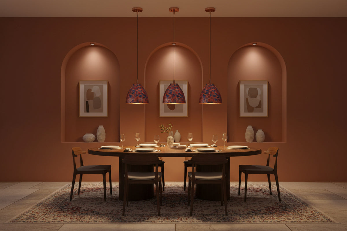 Colorful copper dome pendant lamp installed in a warm restaurant interior with red and blue patterned shade
